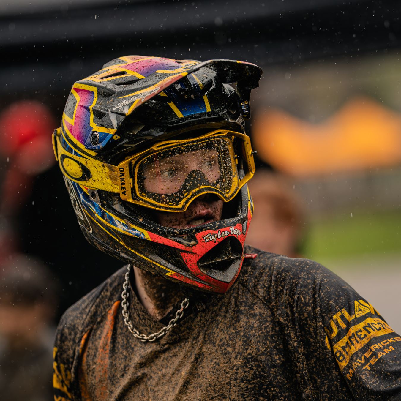 Mud-covered Fred in his helmet and goggles after a wet race run