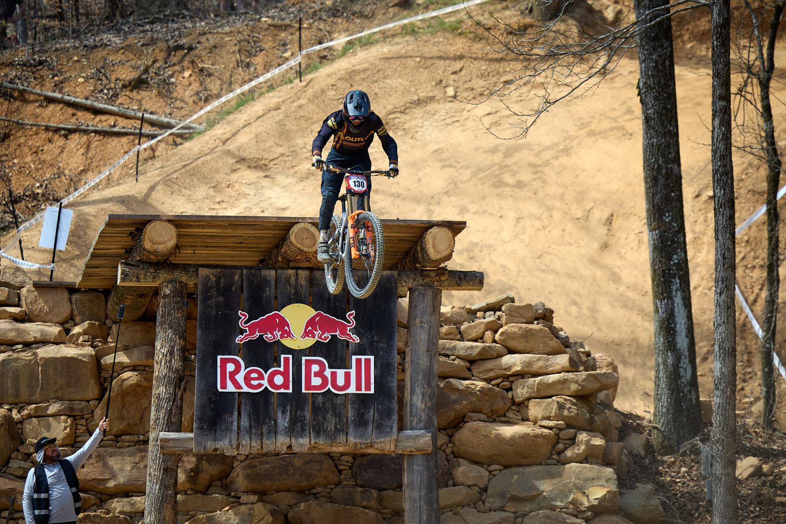 Fred launching over a stone wall at the Red Bull Tennessee National